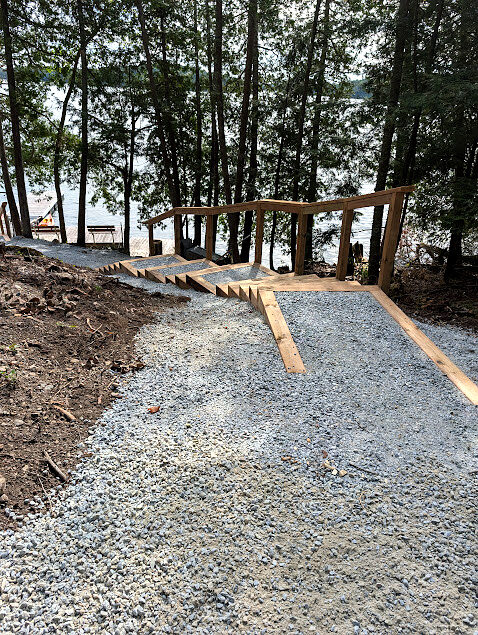 Timber stair treads and gravel path along a shoreline access build