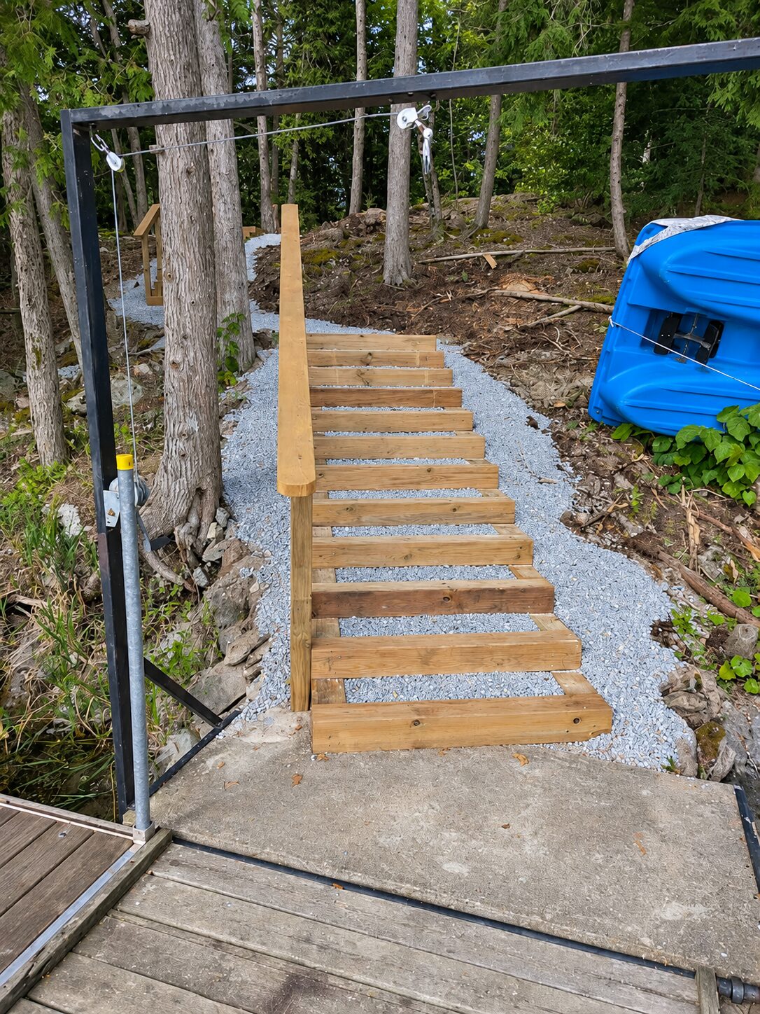 Wooden stairway built through the forest down to a lake shoreline