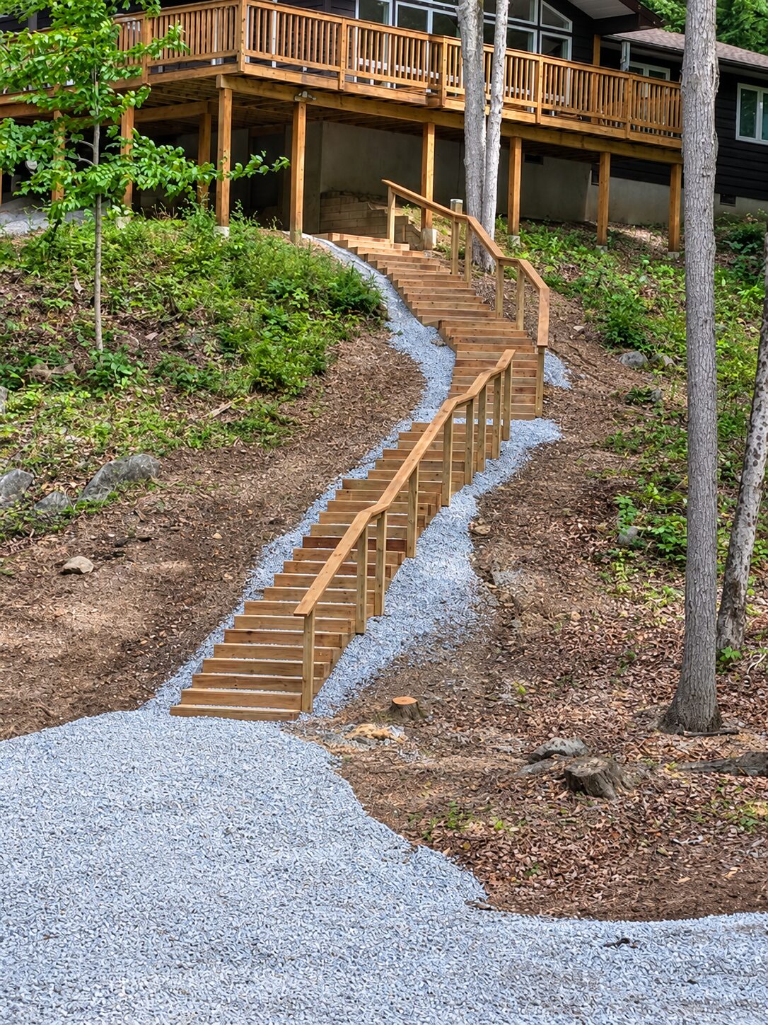 Timber stairway and deck built at a woodland cabin